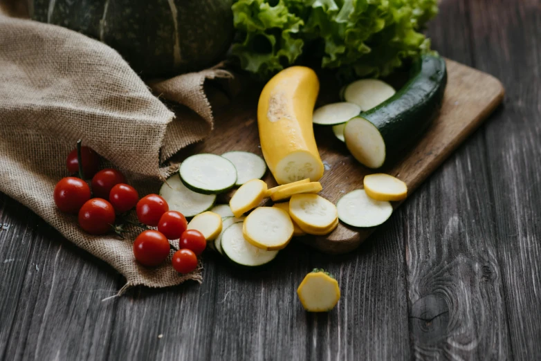 a bunch of vegetables sitting on top of a wooden table, thumbnail, listing image, yellow and green, cucumber