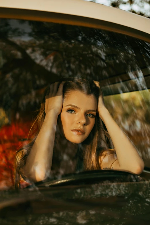 a woman sitting in the driver's seat of a car, a picture, inspired by Elsa Bleda, renaissance, nina agdal, medium head to shoulder shot, album cover, gen z