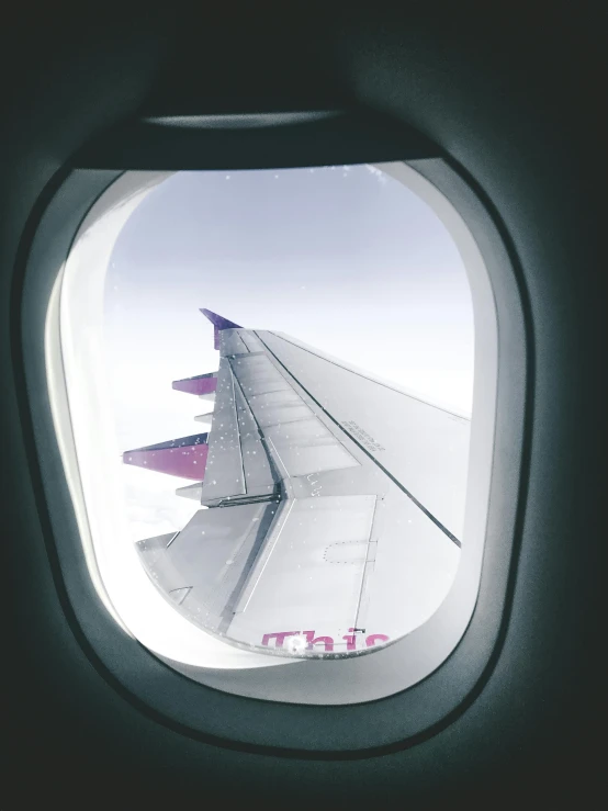 an airplane window with a view of the wing, a cartoon, by Christen Dalsgaard, trending on unsplash, pink and purple, historical photo, floating in mid - air, portrait photo