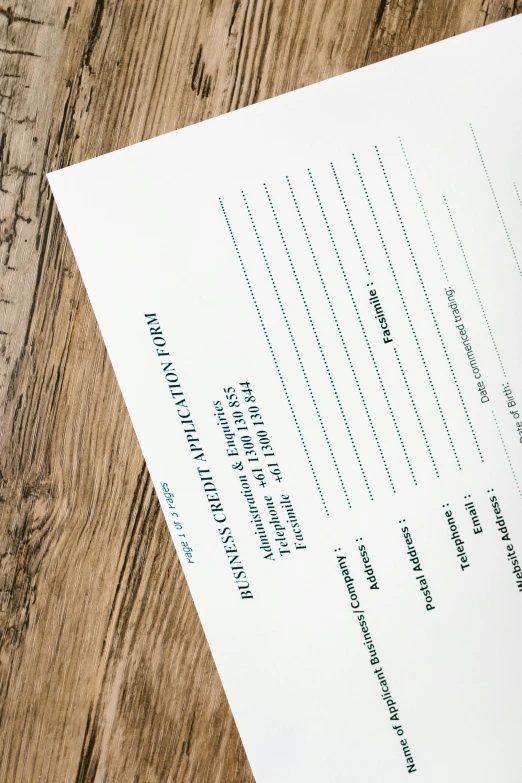 a piece of paper sitting on top of a wooden table, information, thumbnail, forms, detailed product image