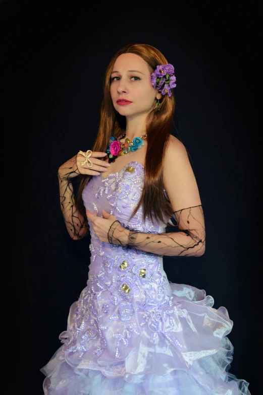 a woman in a purple dress holding a cell phone, an album cover, inspired by Daphne Fedarb, ornate cosplay, ((portrait)), lady with glowing flowers dress, modeled