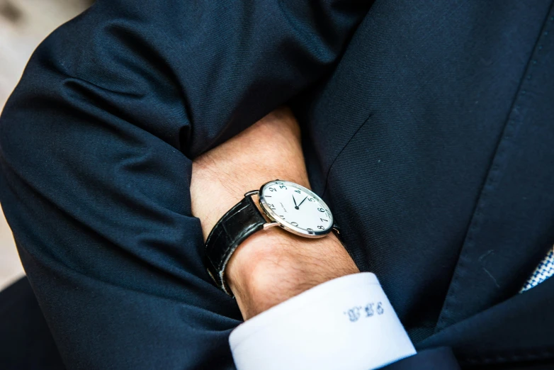 a close up of a person wearing a watch, by Gavin Hamilton, dressed in expensive clothes, resting, white sleeves, thumbnail