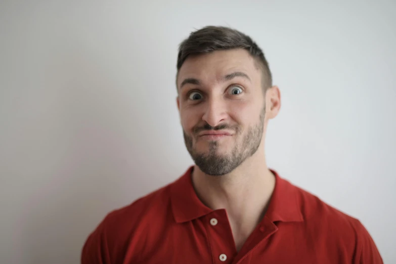 a man with a surprised look on his face, pexels contest winner, light stubble with red shirt, vinny vinesauce, daniil kudriavtsev, profile image