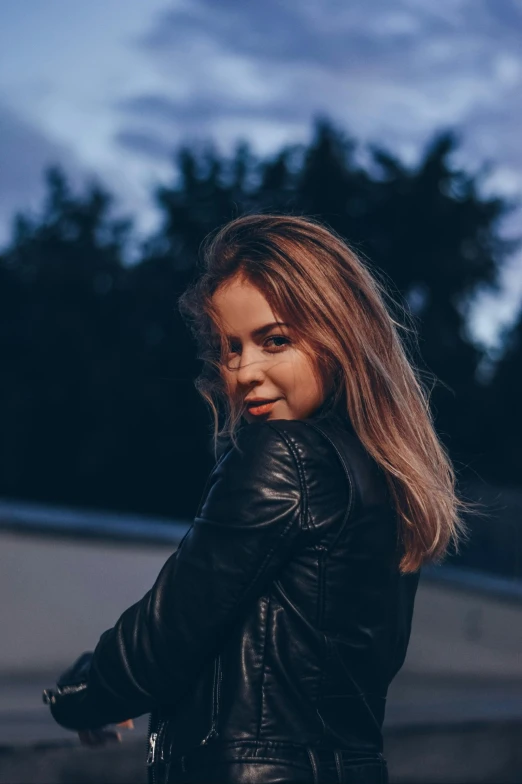 a woman in a leather jacket posing for a picture, an album cover, inspired by Elsa Bleda, pexels contest winner, happening, 🤤 girl portrait, summer evening, dark blonde hair, russian girlfriend