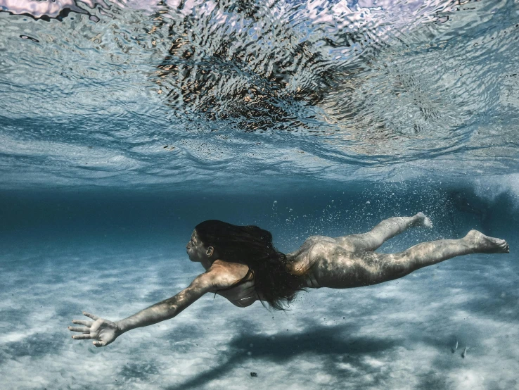 a woman swimming under a wave in the ocean, figuration libre, wavy hair spread out, wētā fx, translucent skin, instagram photo