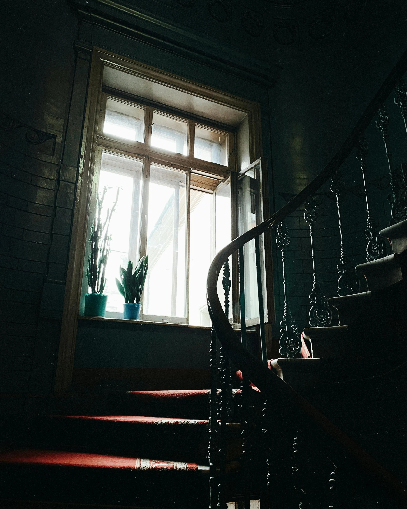 a staircase leading up to a window in a dark room, lgbtq, dark academia aesthetics, leaked photo, multiple stories