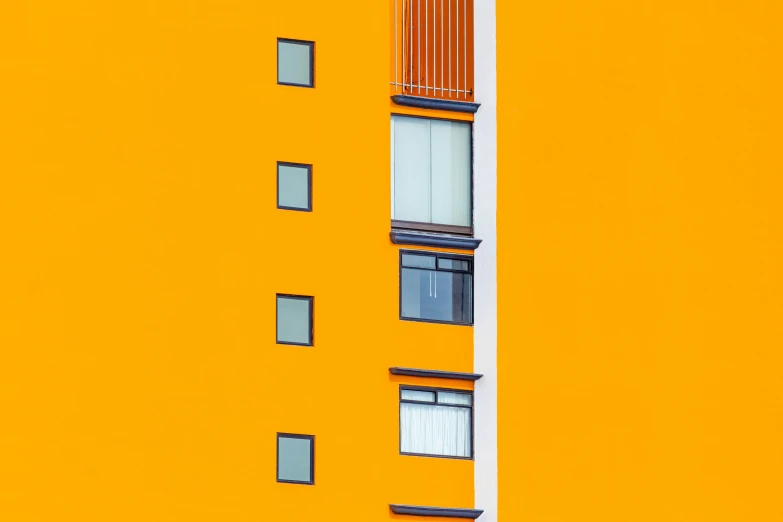 a tall yellow building with lots of windows, unsplash contest winner, bauhaus, colors orange, hyper-realism, square lines, 8k 50mm iso 10