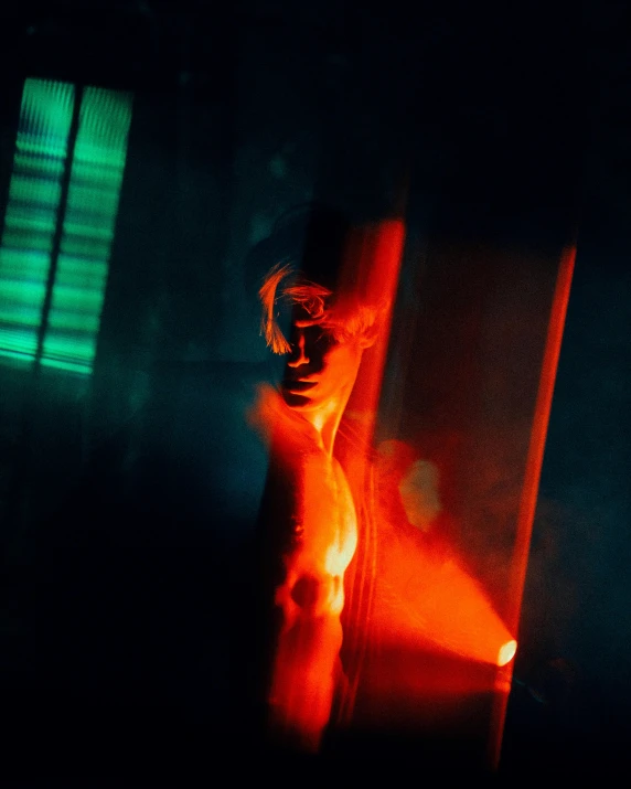 a man that is standing next to a pole, inspired by Elsa Bleda, holography, red light from some windows, glass torso, mert and marcus, scene from fightclub movie