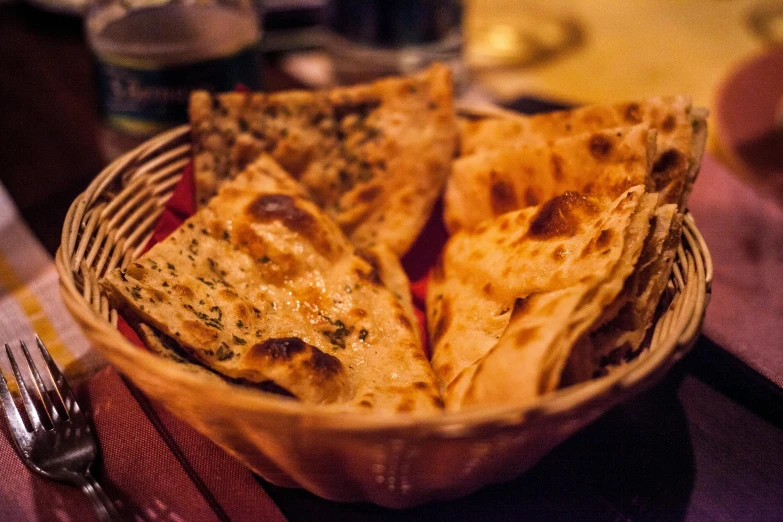 a close up of a basket of food on a table, dau-al-set, fan favorite, desi, toast, nighttime