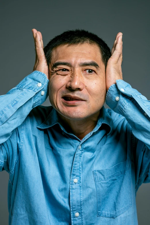 a man covering his eyes with his hands, shin hanga, confused facial expression, paul lung, face-on head shot, shrugging