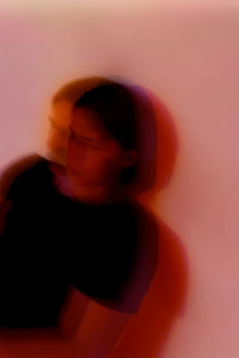 a blurry photo of a woman leaning against a wall, inspired by Anna Füssli, conceptual art, colored projections, in the astral plane ) ) ), peter saville, portait image