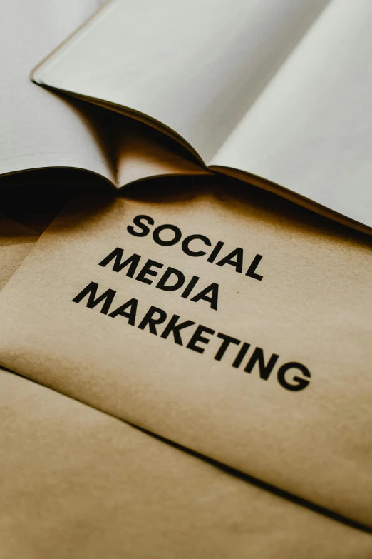 an open book with the words social media marketing on it, trending on pexels, brown:-2, low quality photo, thumbnail, 15081959 21121991 01012000 4k