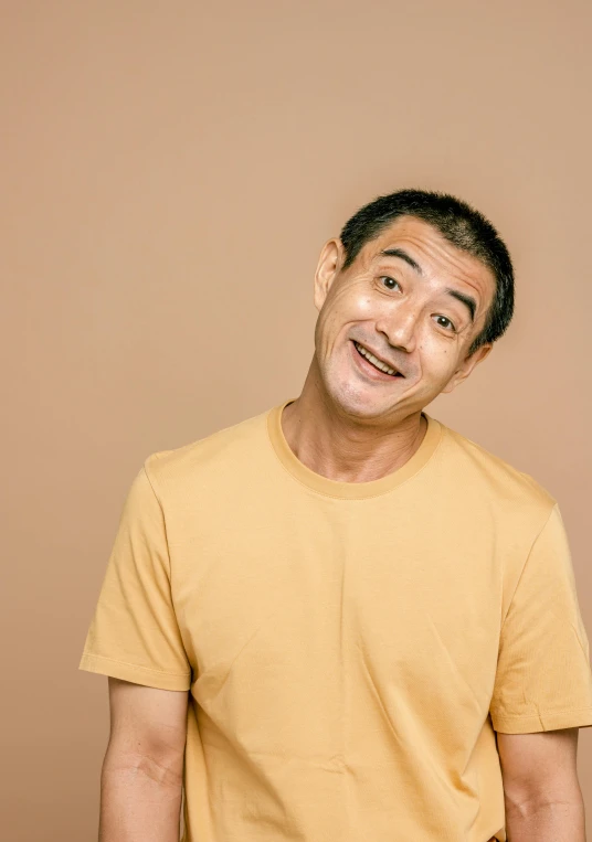 a man with a surprised look on his face, a character portrait, inspired by Chen Daofu, trending on pexels, mingei, light tan, dimples, standup comedian, ethnicity : japanese