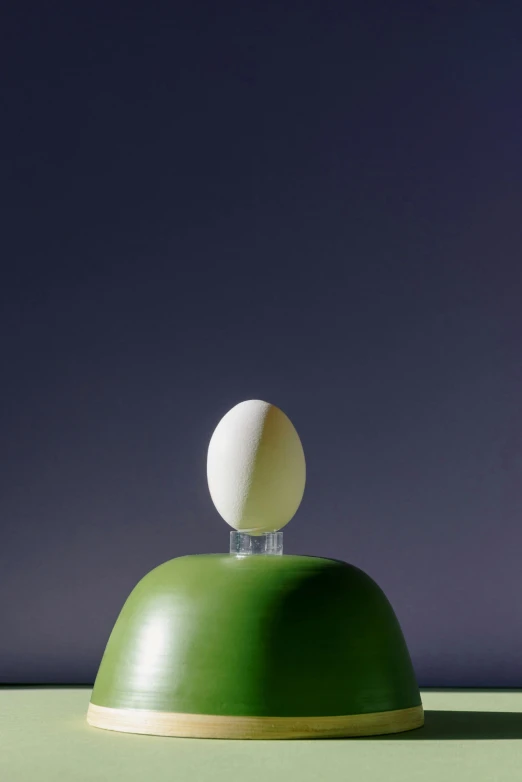 a white egg sitting on top of a green bowl, a surrealist sculpture, by Doug Ohlson, conceptual art, 1997 ), square, apple, 15081959 21121991 01012000 4k