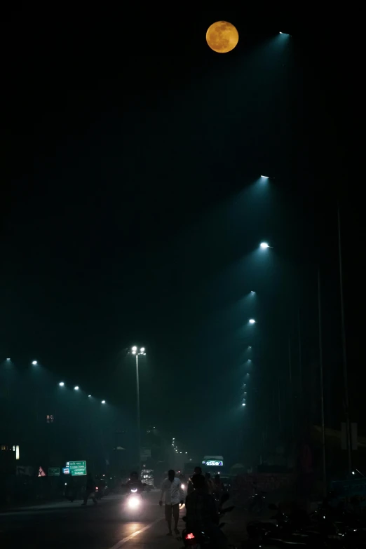 a street filled with lots of traffic at night, a picture, reddit, conceptual art, midnight mist streetlights, faded!! very soft lights, dramatic stadium lighting, night time photography