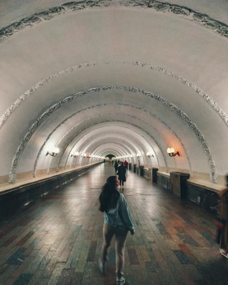 a couple of people that are standing in a tunnel, unsplash contest winner, socialist realism, russian architecture, 🚿🗝📝, lgbt, panoramic view of girl