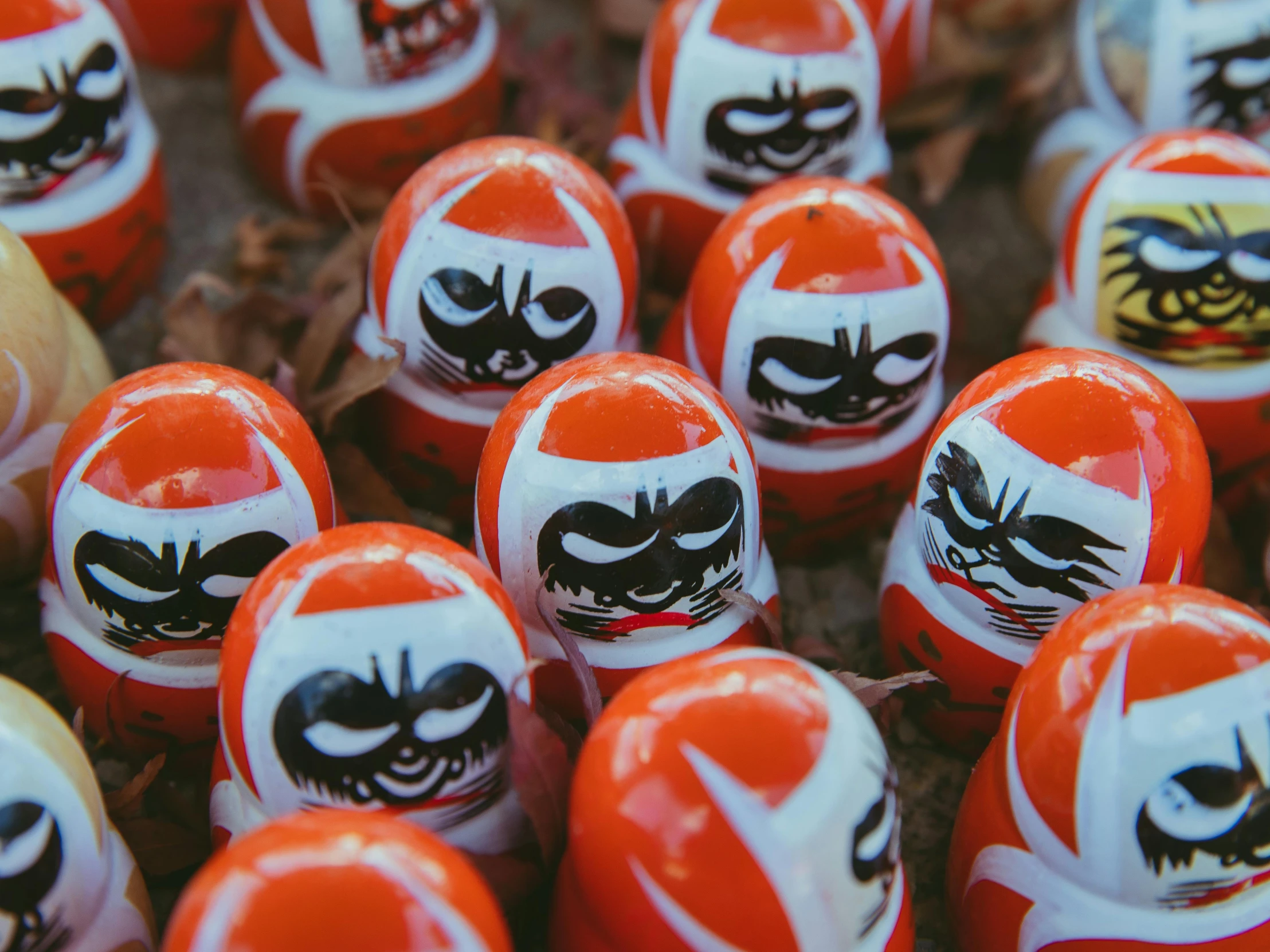 a close up of a bunch of red and white eggs, inspired by Nara Yoshitomo, pexels contest winner, orange demons, japanese village, square, masks