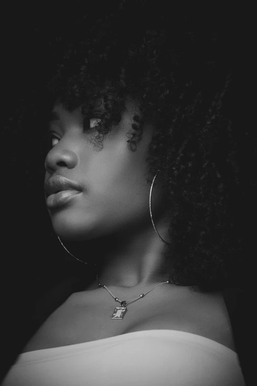 a black and white photo of a woman with curly hair, by Lily Delissa Joseph, realism, black teenage girl, isolated, (beautiful) girl, music video