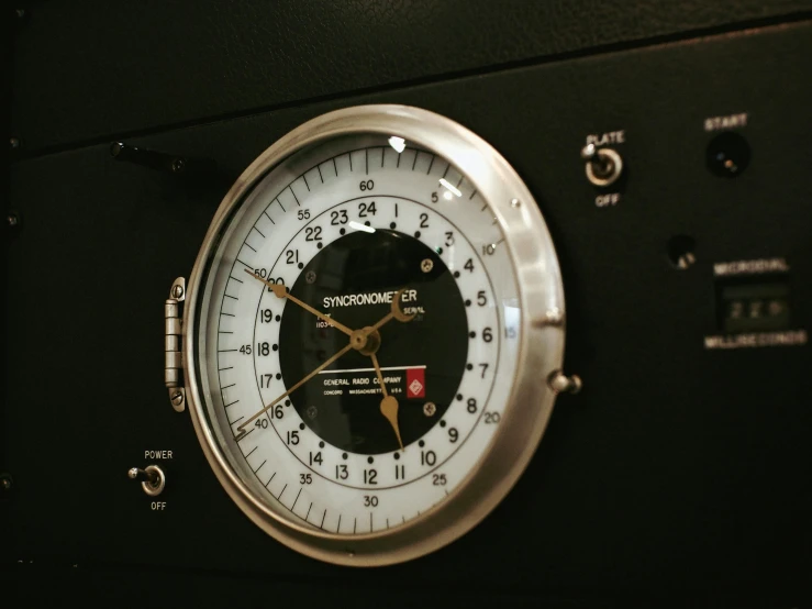 a close up of a clock on a wall, button potenciometers, underground lab, panavision, barometric projection