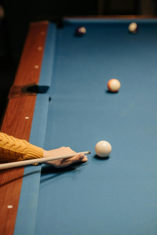 a person is playing a game of pool, laura watson, bottom shot, half blue, lane brown