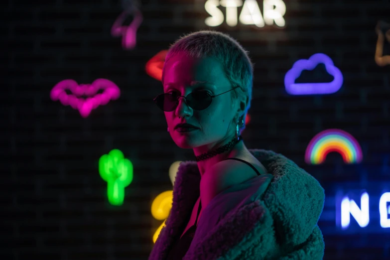 a woman standing in front of neon signs, inspired by Elsa Bleda, trending on pexels, star child, non binary model, killstar, with stars