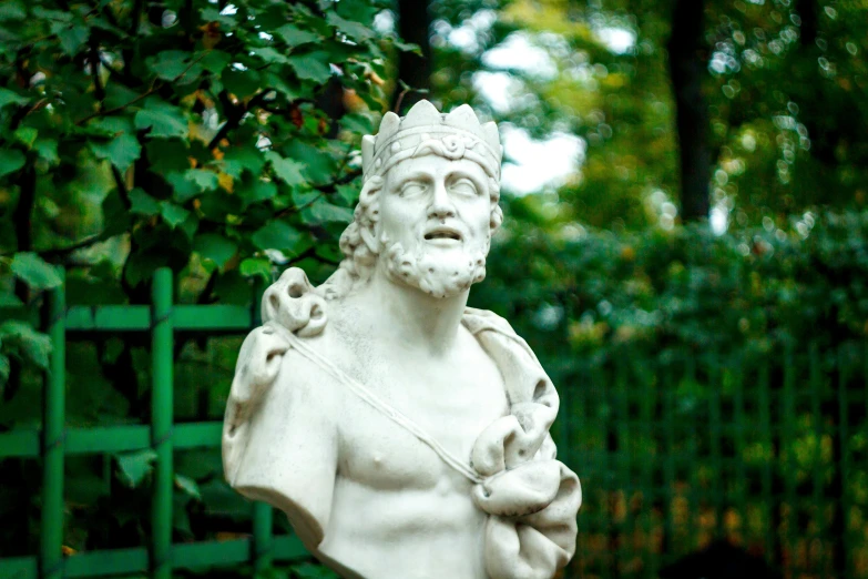 a statue of a man holding a baby, a statue, inspired by Roman Bezpalkiv, unsplash, art nouveau, wearing a crown of vines, statue of hercules looking angry, the emerald herald in the garden, фото девушка курит