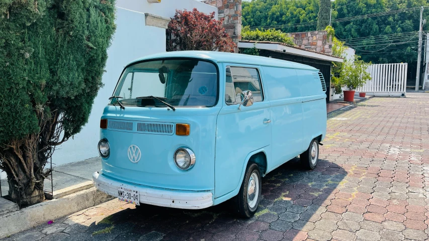 a blue van parked on the side of a road, a portrait, by Alejandro Obregón, unsplash, 70s photo, 🦩🪐🐞👩🏻🦳, vanilla, !!highly detailed!!