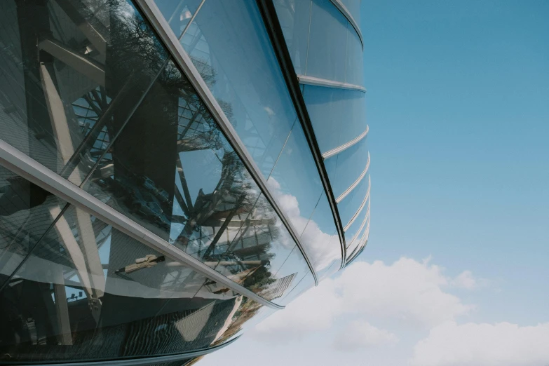 a reflection of the eiffel tower in the glass of a building, inspired by Zaha Hadid, pexels contest winner, rounded roof, gondola, thumbnail, low angle 8k hd nature photo