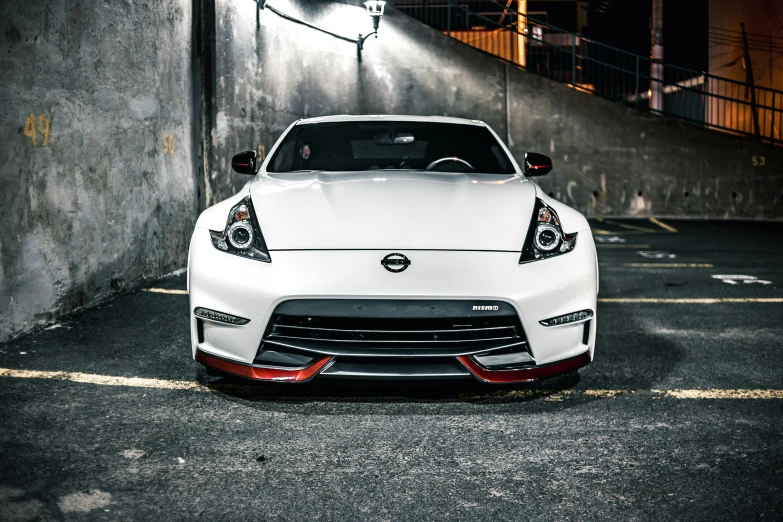 a white sports car parked in a parking lot, inspired by Nōami, unsplash, white and red body armor, front lighting, instagram picture, 15081959 21121991 01012000 4k