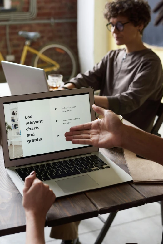 a group of people sitting at a table with laptops, a digital rendering, by Dan Content, trending on unsplash, square, brown, infographics, with a laptop on his lap