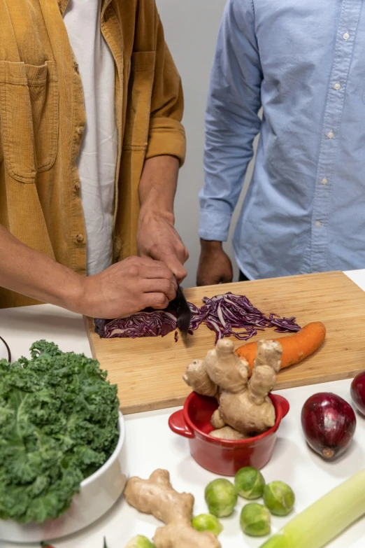 two men are cutting vegetables on a cutting board, by Jessie Algie, uncrop, background image, maroon, asian male