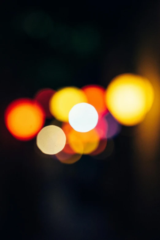a blurry photo of a street at night, pexels, light and space, colourful close up shot, light circles, soft light - n 9, paul barson