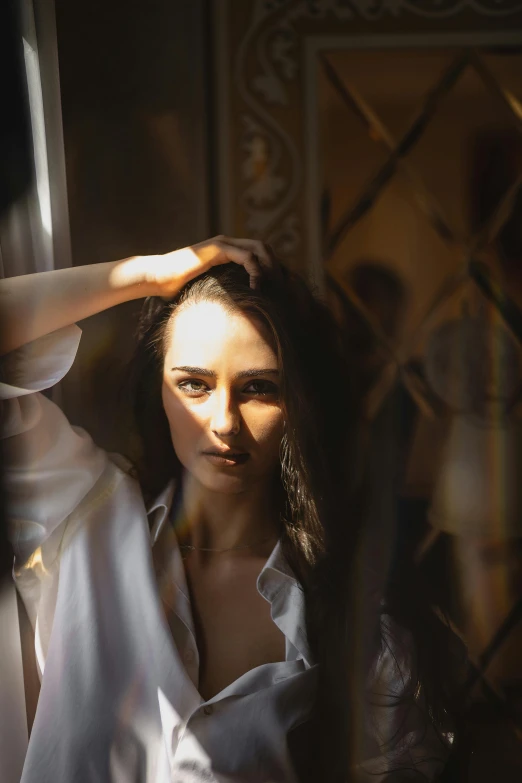 a woman that is standing in front of a mirror, pexels contest winner, photorealism, sunlight shining through windows, handsome girl, soft light - n 9, brunette