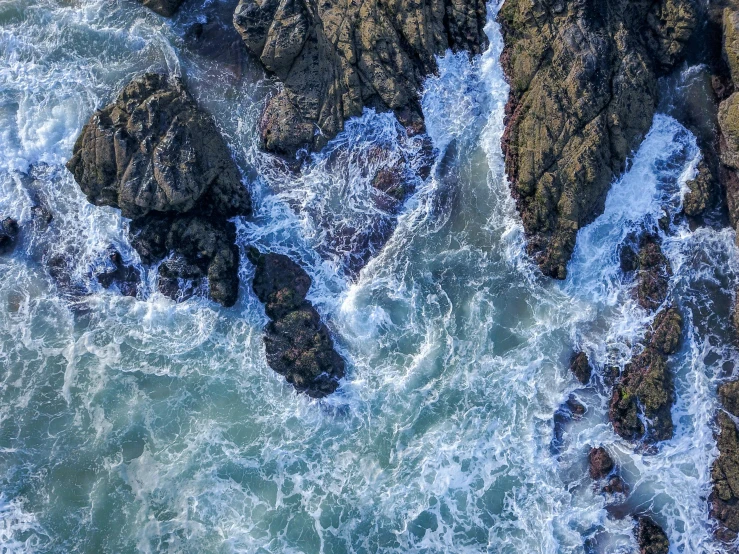 a bird's eye view of the ocean and rocks, pexels contest winner, process art, overflowing energy, thumbnail, pembrokeshire, white water