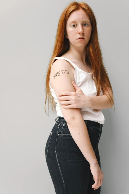 a woman with a tattoo on her arm, antipodeans, rated t for teen, hr ginger, medium long shot, cut out