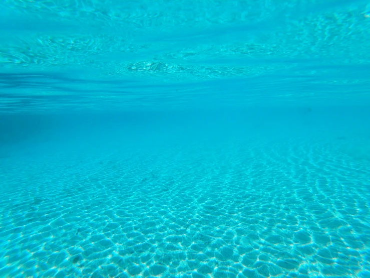 the bottom of a swimming pool with clear water, unsplash, sea of parfait, underwater westminster, soft blue light, sand and sea