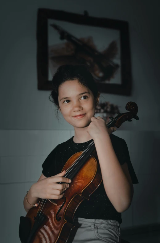 a young girl holding a violin in her hands, an album cover, by Alejandro Obregón, pexels contest winner, greta thunberg, headshot profile picture, indoor picture, avatar image