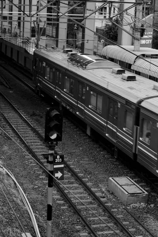 a black and white photo of a train on the tracks, a black and white photo, flickr, in tokio, in barcelona, sequential, square lines