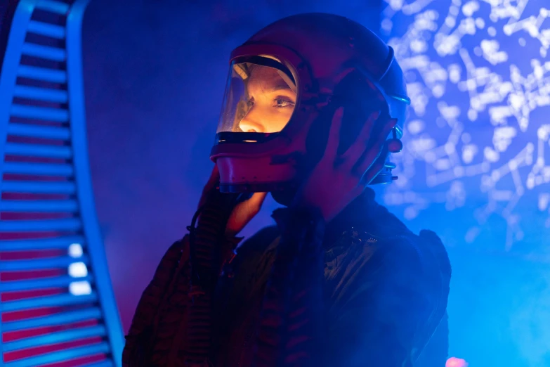 a man in a helmet talking on a cell phone, by Lee Loughridge, symbolism, cinematic neon uplighting, 70's jetfighter pilot girl, the expanse tv series, photograph taken in 2 0 2 0
