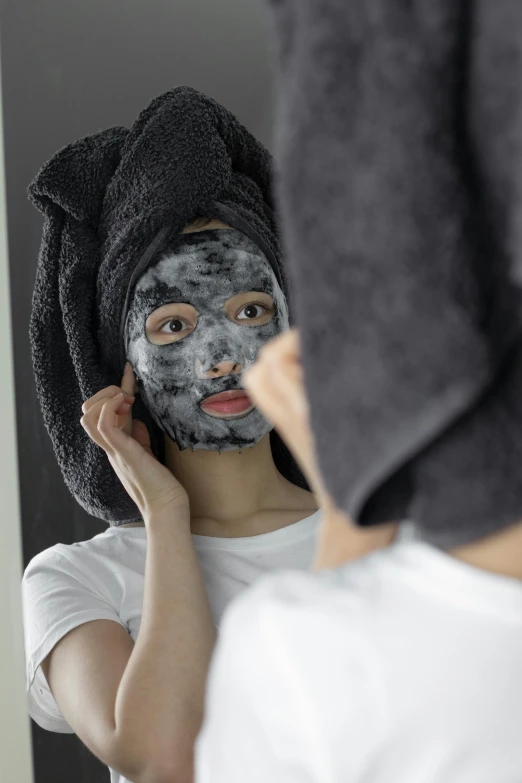 a woman that is standing in front of a mirror, facemask, gray mottled skin, korean face features, charcoal color skin