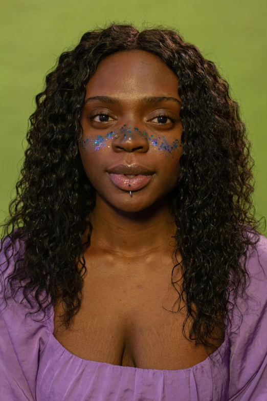 a woman with blue paint on her face, an album cover, by artist, renaissance, dark purple skin, wax figure, pose 4 of 1 6, multi colored