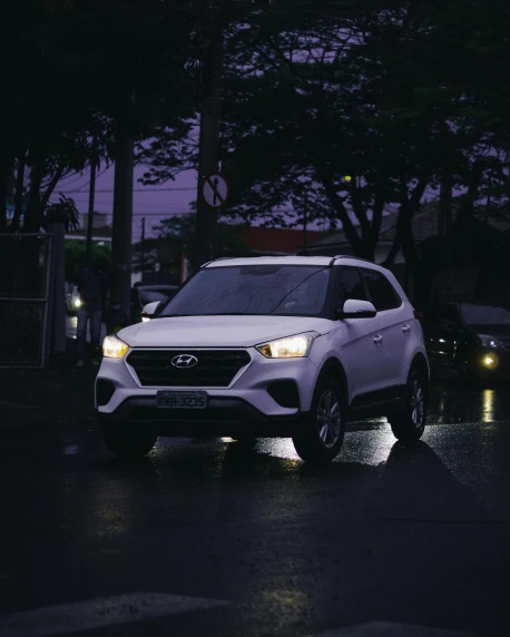 a white suv driving down a street at night, an album cover, by Adam Rex, pexels contest winner, square, xenon, non-binary, car