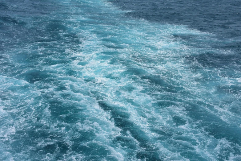 a view of the ocean from the back of a boat, pexels, hurufiyya, swirling fluid, thumbnail, cerulean, running water