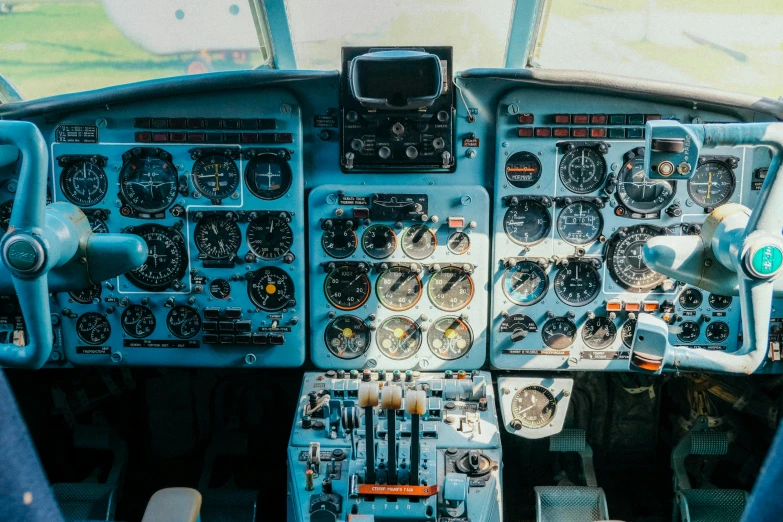 a view of the cockpit of a plane, pexels, retrofuturism, fan favorite, wes anderson film, sky blue, control panels