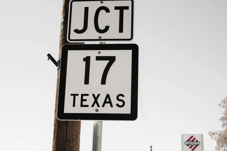 a close up of a street sign on a pole, an album cover, by Jacob Toorenvliet, unsplash, conceptual art, tx, in 1 7 6 7, jen zee, accurate roads
