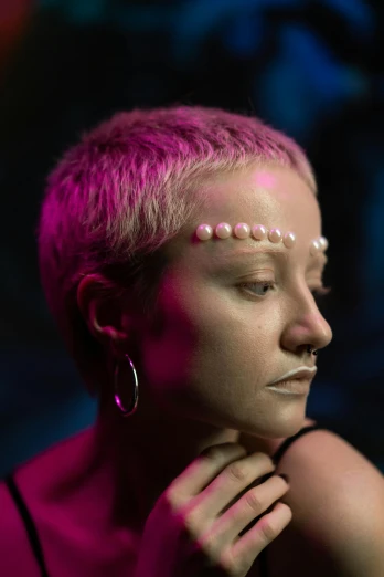 a woman with white paint on her face, an album cover, inspired by Elsa Bleda, trending on pexels, hyperrealism, girl with a pearl earringl, pink short hair, exotic alien features, shaved temple