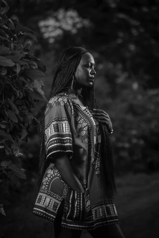 a woman in a black and white photo, inspired by Ras Akyem, in the evening, promo shoot, photo taken in 2018, standing