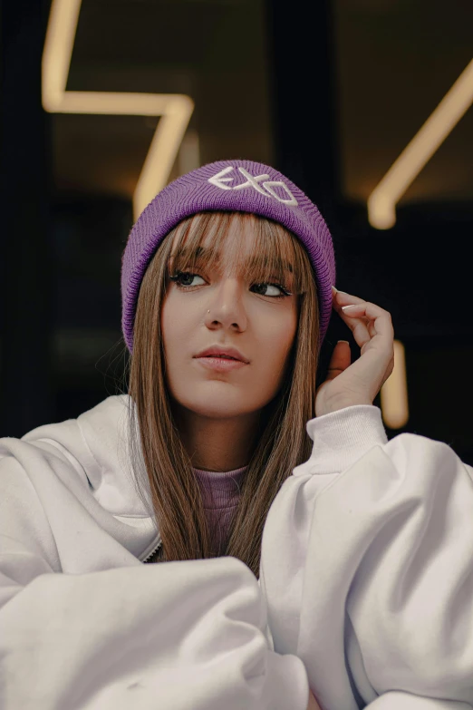 a woman with long hair wearing a purple beanie, an album cover, trending on pexels, x logo, anastasia ovchinnikova, lalisa manobal, discord profile picture