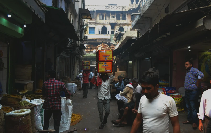 a group of people walking down a street, pexels contest winner, bengal school of art, inside an arabian market bazaar, cardboard, promo image, howrah bridge