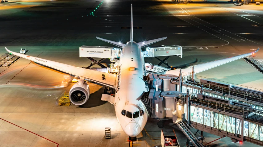 a large jetliner sitting on top of an airport tarmac, by Jay Hambidge, pexels contest winner, busy night, avatar image, cyborg aircraft parts, thumbnail